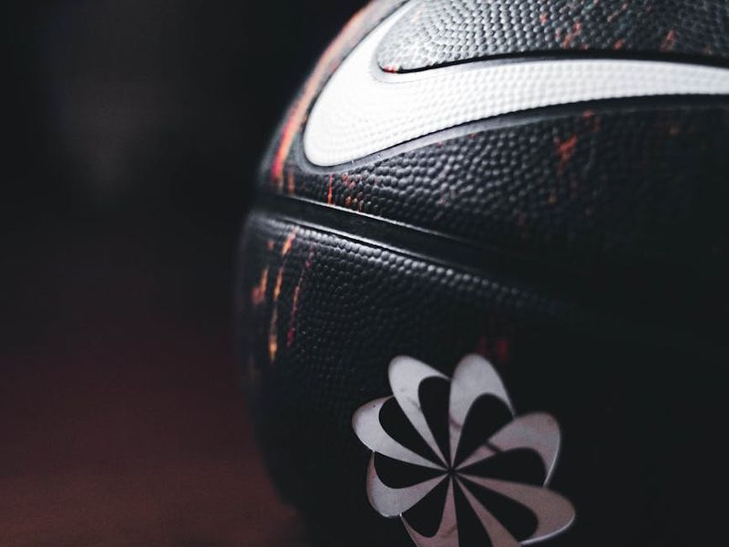 Detailed shot of sports equipment on a dark wooden floor.